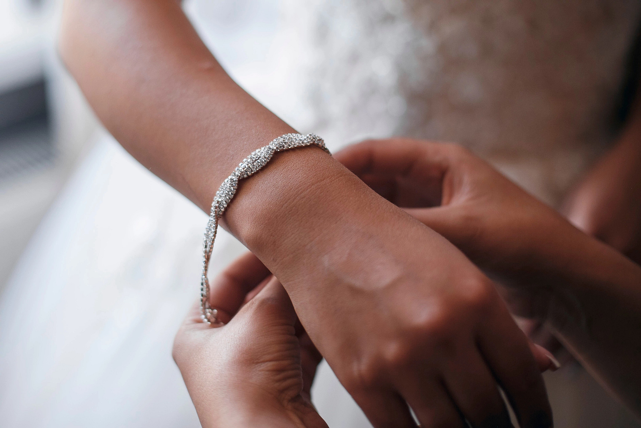 Bride putting on a Bracelet