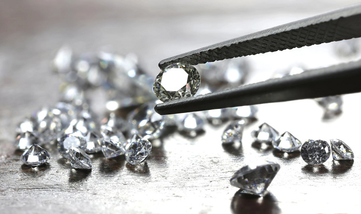 Diamonds held by tweezers