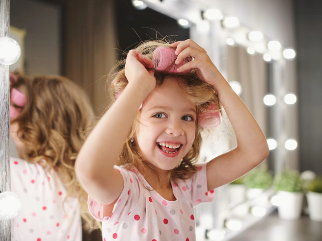 Girl curling her hair